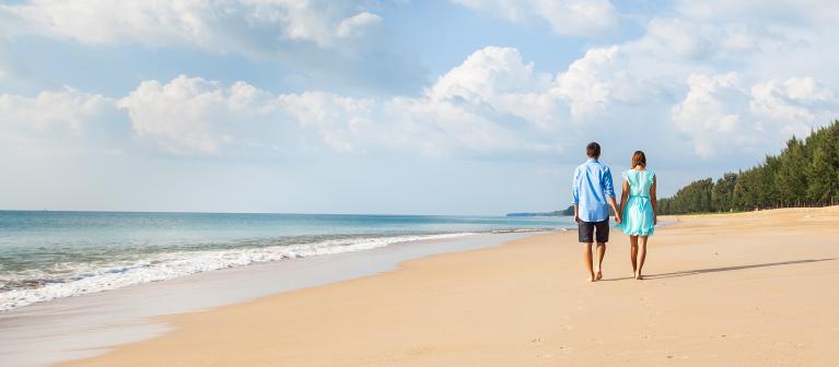 Young Couple Walking on a Beach